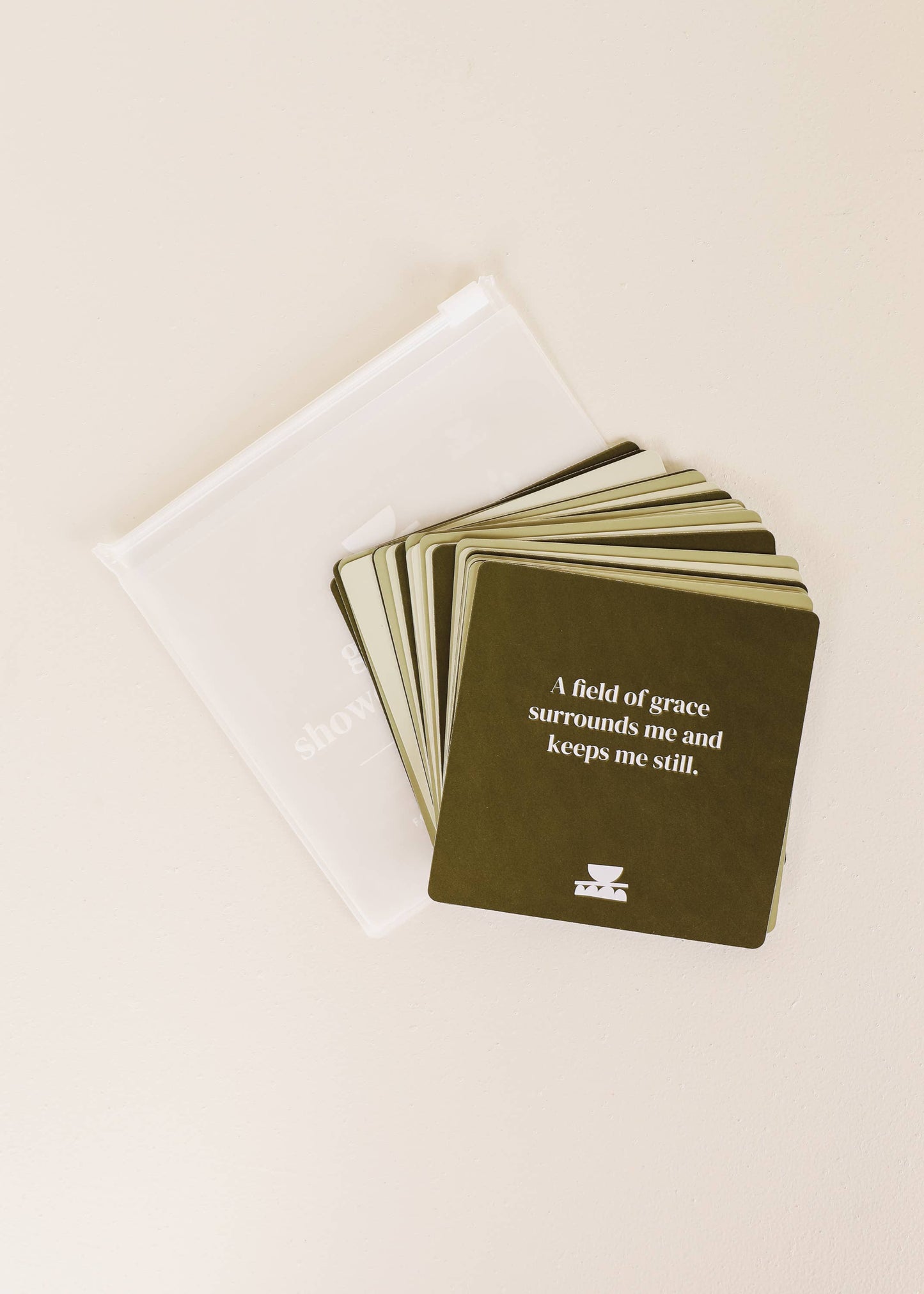 Set of cards with a quote on a white surface